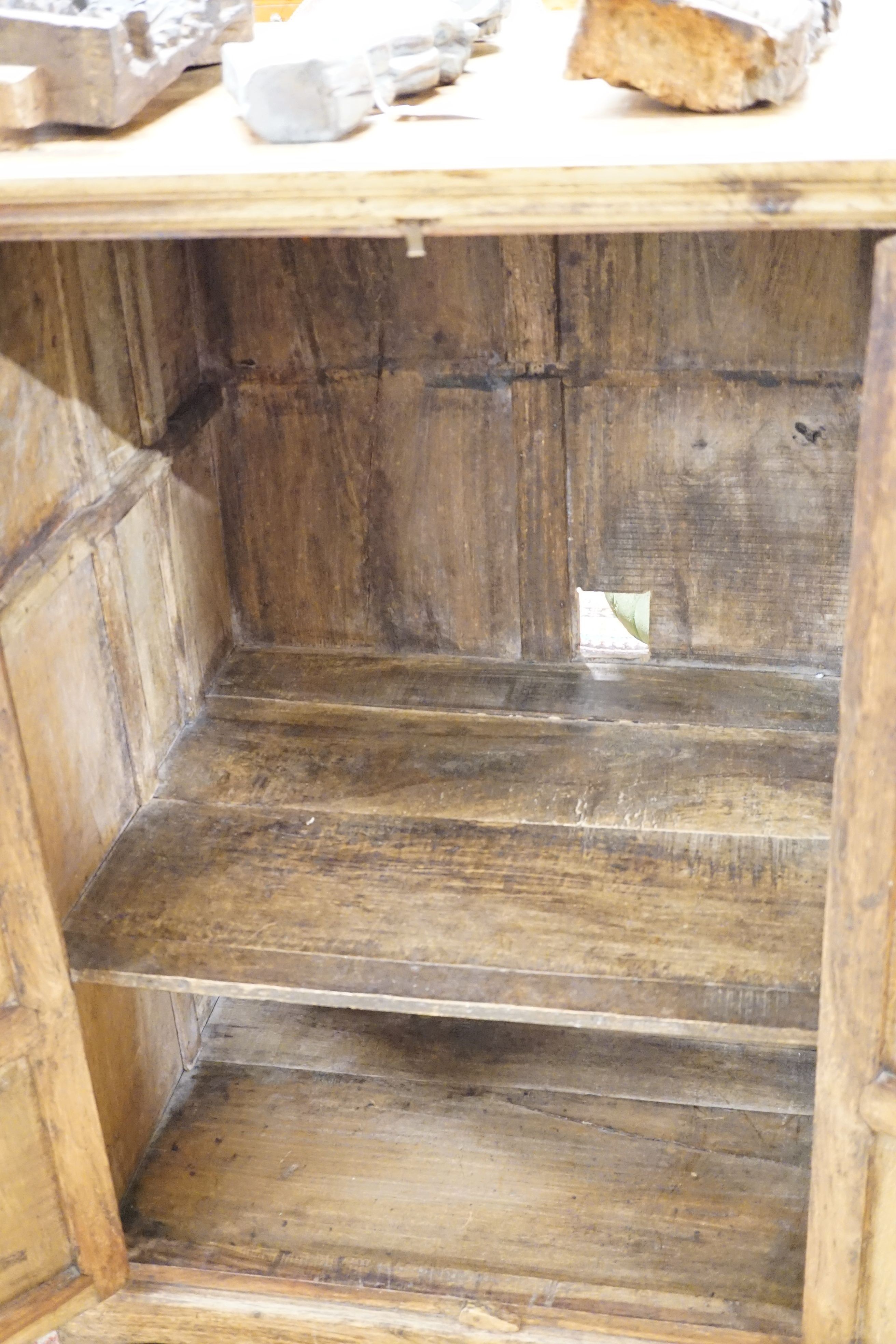 An Indian carved hardwood cupboard, width 77cm, height 107cm